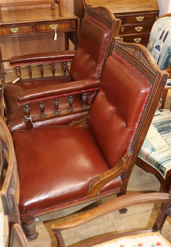 A pair of Victorian oak library chairs